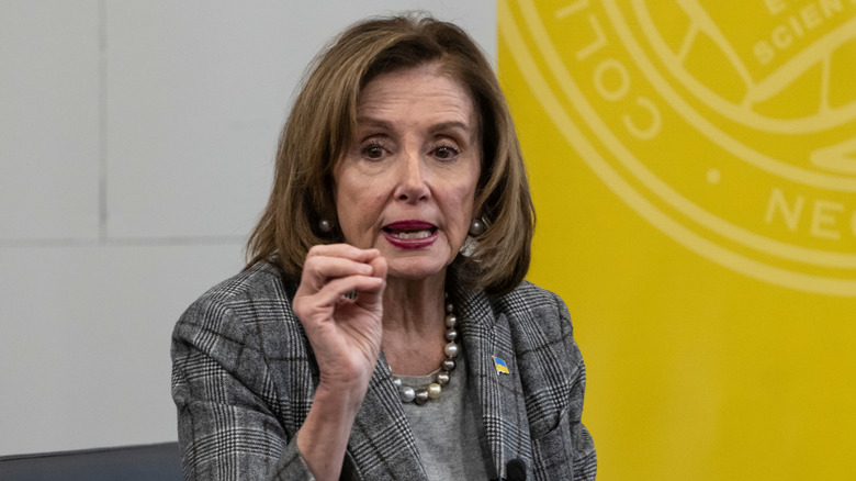 Nancy Pelosi gesturing with her hand as she speaks