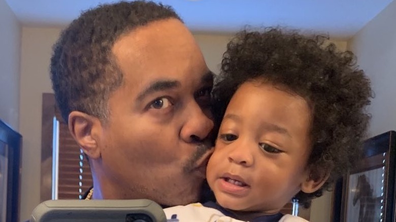 Deon Derrico posing with his son