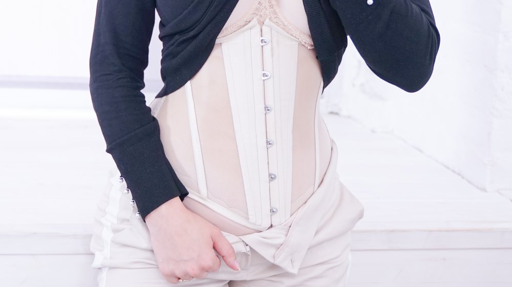 Woman wearing a waist trainer under her clothes