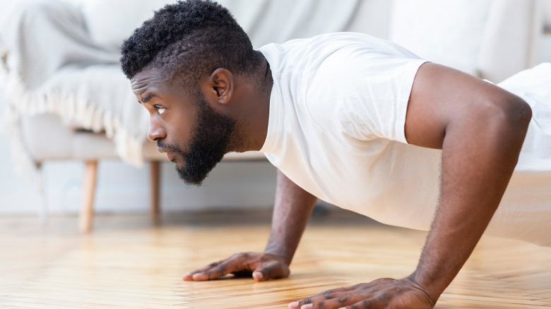 man doing pushups at home