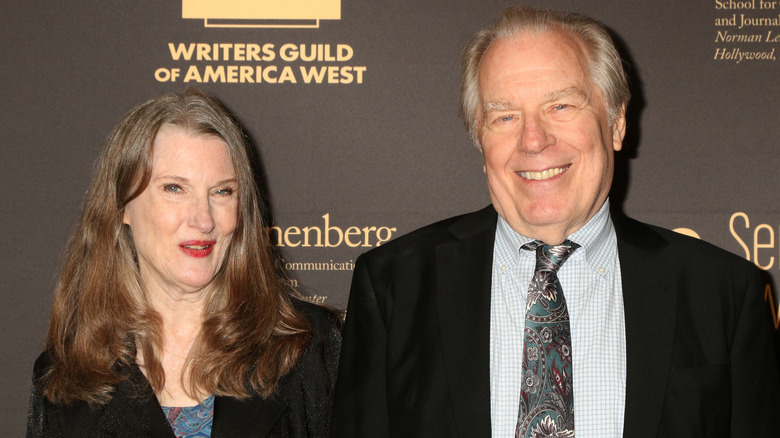 Michael McKean and Annette O'Toole smiling at an event