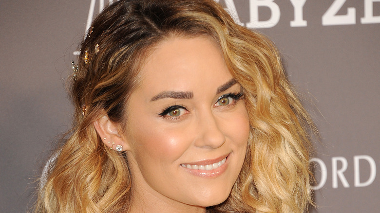 Lauren Conrad tilting her head to the side to pose for a picture