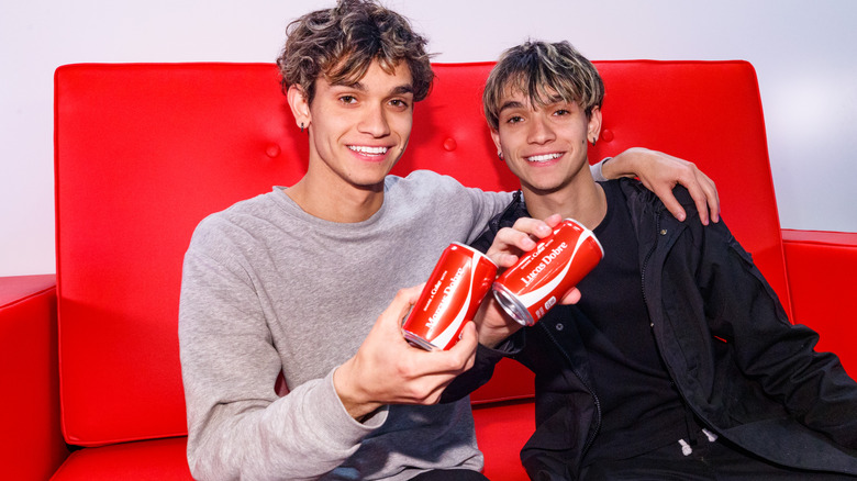 The Dobre Twins with Coke cans