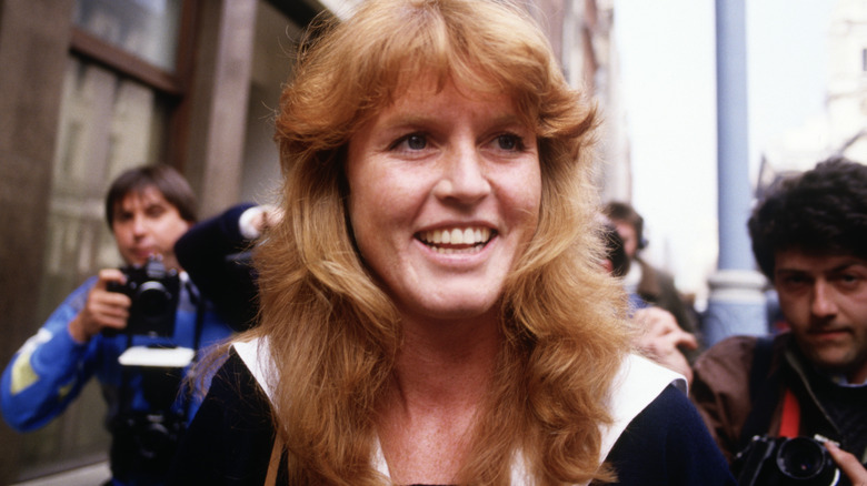 Sarah Ferguson surrounded by photographers on the streets of London