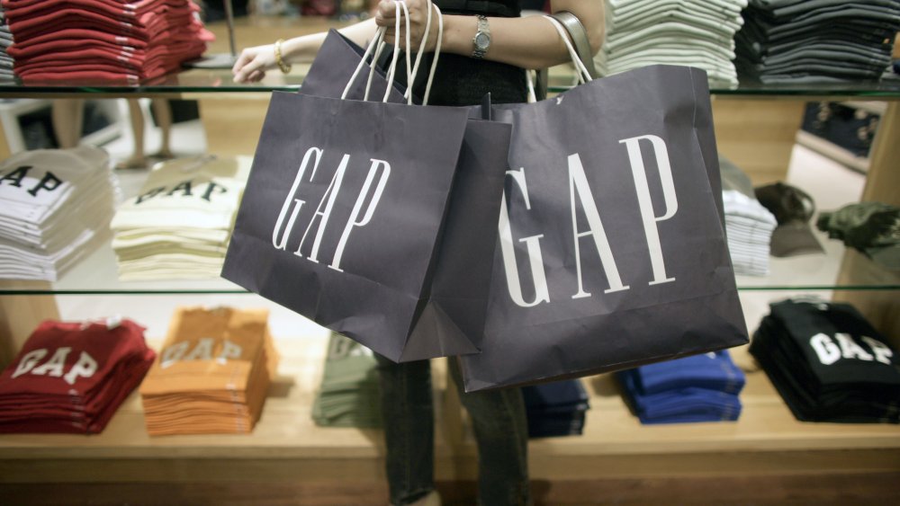 Woman carrying Gap bags