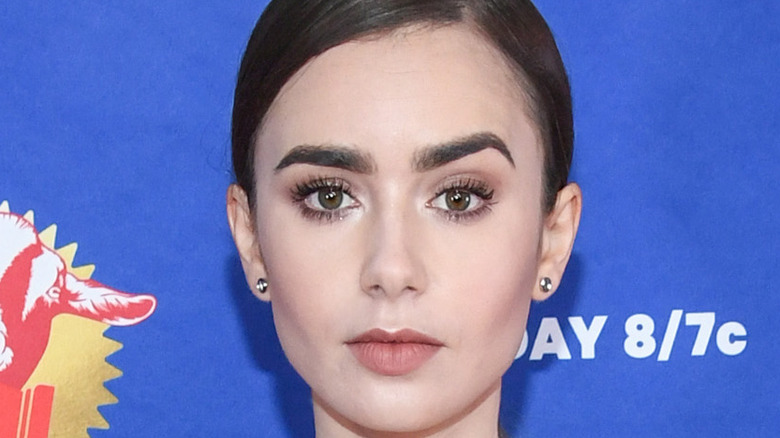 Lily Collins poses on the red carpet