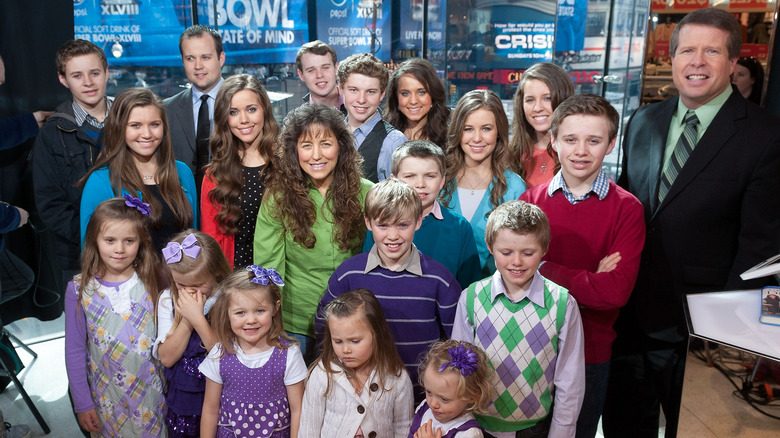 The Duggar family pose together at an event