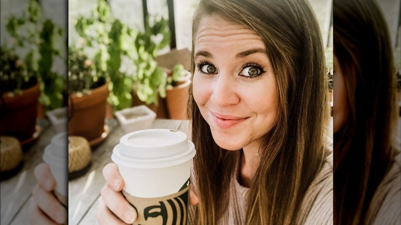 Jana Duggar holding coffee cup