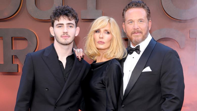 Finn Little, Kelly Reilly, and Cole Hauser posing together in formal wear at a 