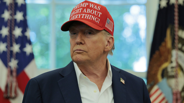 Donald Trump wearing his "Trump was right about everything!" hat