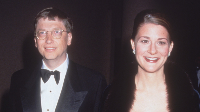 Bill and Melinda Gates smiling while attending an event in 1999