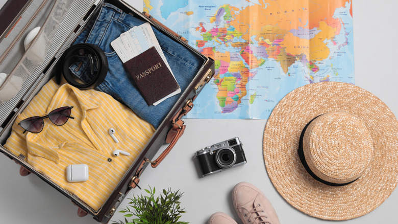 Open suitcase and passport