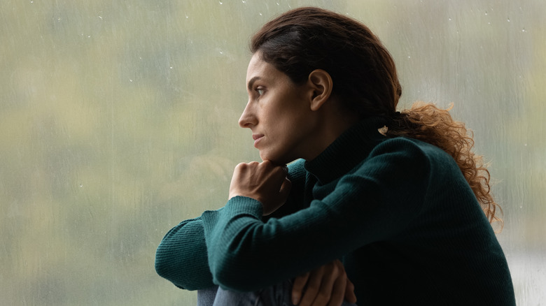 A woman staring out the window