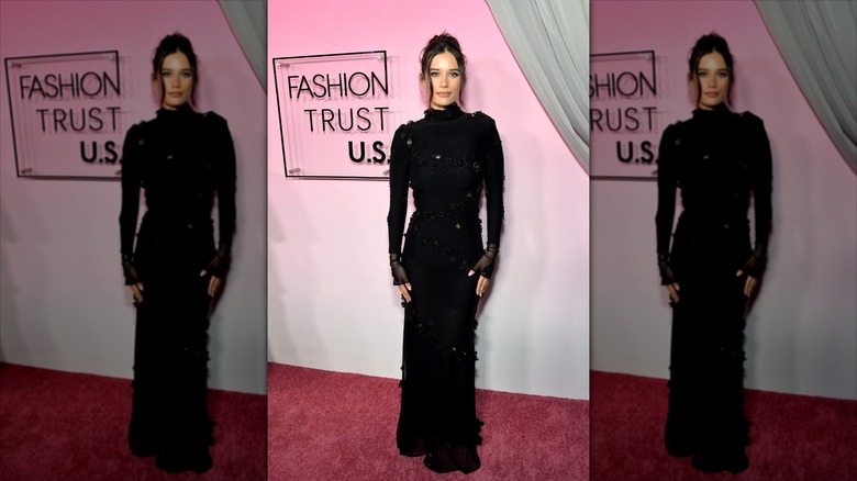 Ella Bleu Travolta in a black textured gown on the Fashion Trust US Red Carpet