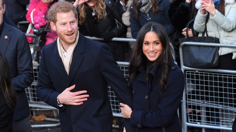 Prince Harry and fiancee Meghan Markle attend the Terrance Higgins Trust World AIDS Day charity fair at Nottingham Contemporary on December 1, 2017 in Nottingham, England.