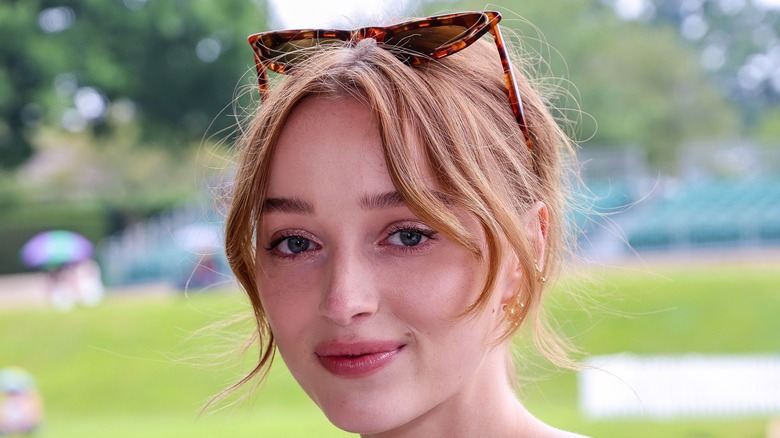 Phoebe Dynevor poses at an event
