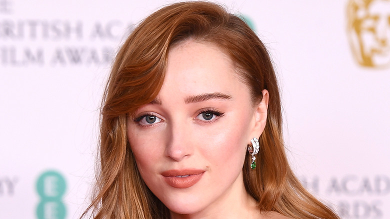 Phoebe Dynevor poses on the red carpet