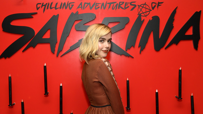 Kiernan Shipka poses at an event for CAOS