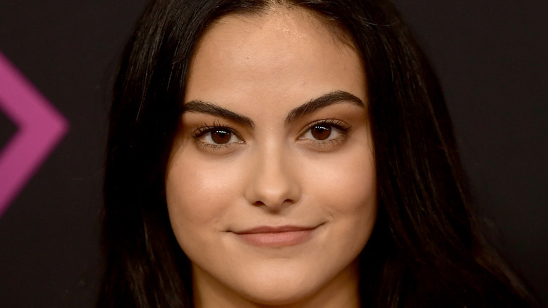 Camila Mendes poses at an event