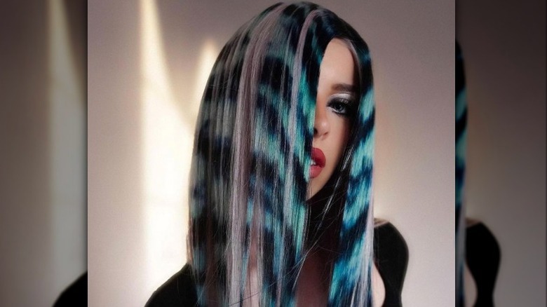 person with hair painting