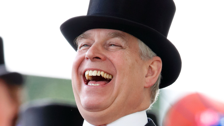 Prince Andrew laughing in a top hat