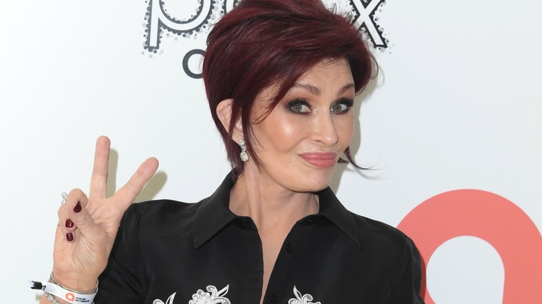 Sharon Osbourne making a peace sign