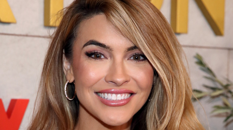 Chrishell Stause smiling on red carpet 