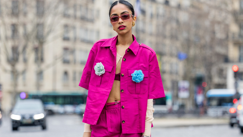 Woman in magenta outfit