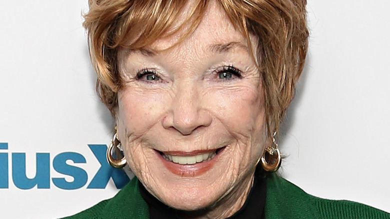 Shirley MacLaine smiling on the red carpet