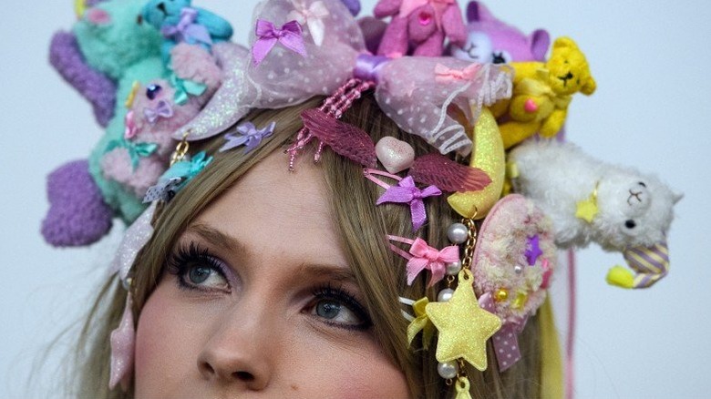 Young woman wearing a crown made of tiny stuffed animals