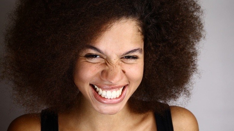 Woman giving a big smile with her entire face