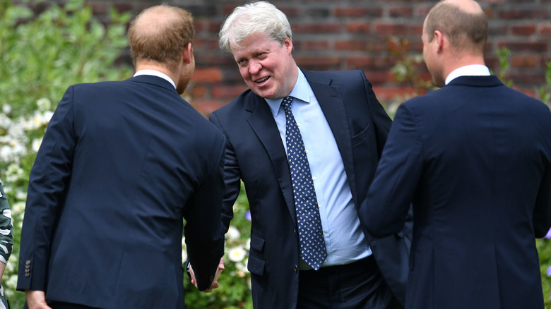 Earl Spencer shaking Prince William and Prince Harry's hands