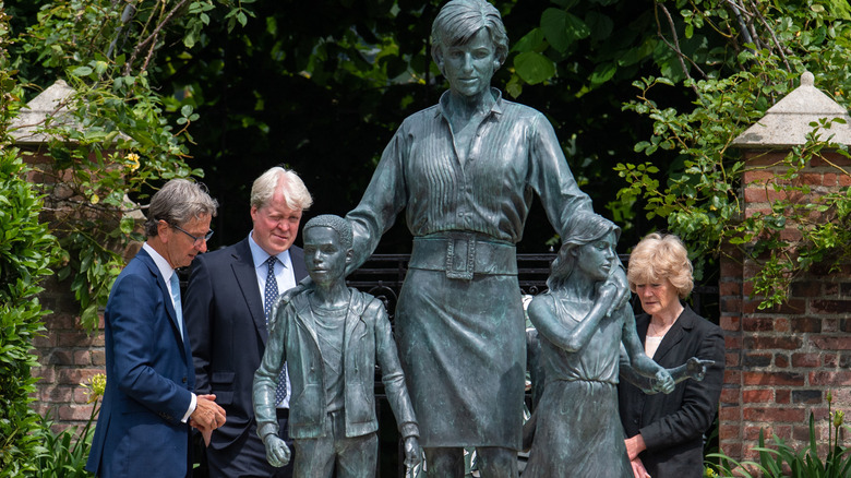 Earl Spencer standing beneath the statue of Princess Diana