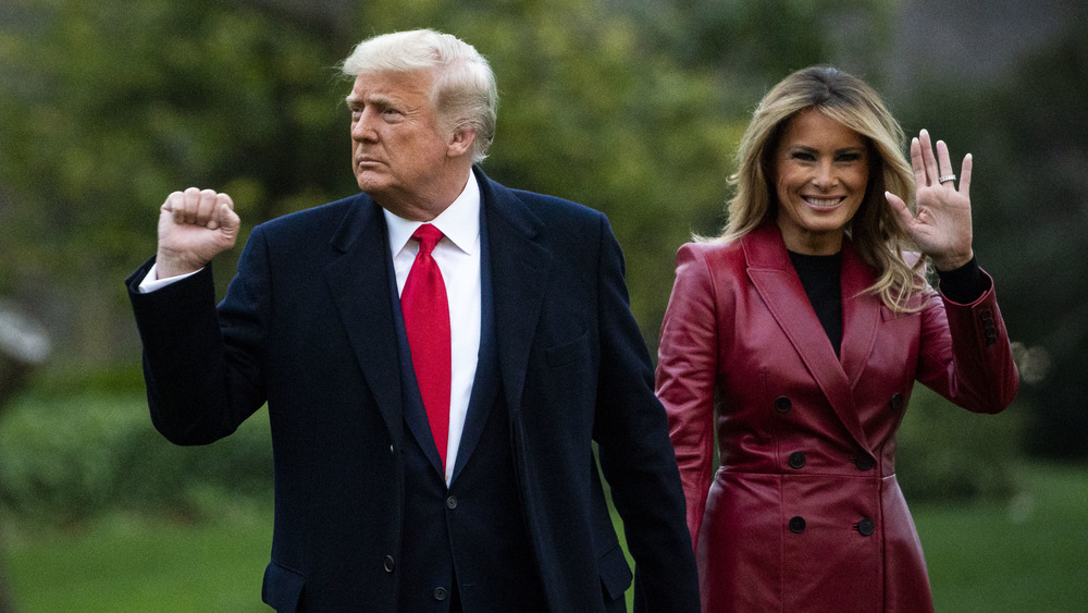 Donald and Melania Trump walking and waving