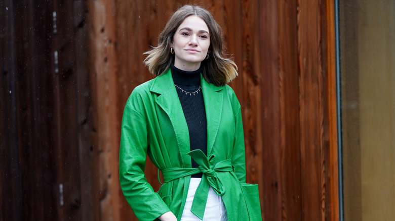 Woman wearing Kelly green jacket