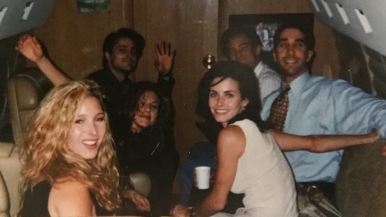 The "Friends" cast posing for a photo on a private jet heading to Las Vegas before the show's pilot premiered in 1994