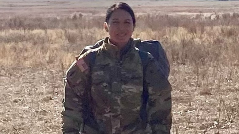 Tulsi Gabbard smiling in her U.S. military outfit