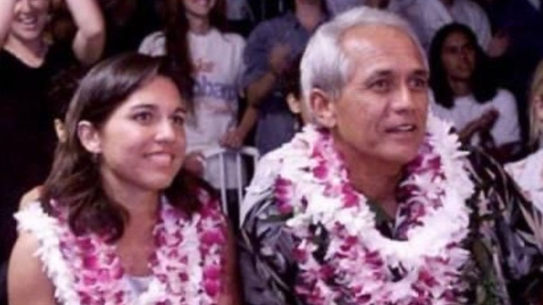 Tulsi Gabbard sitting with her father Mike Gabbard (on the right)