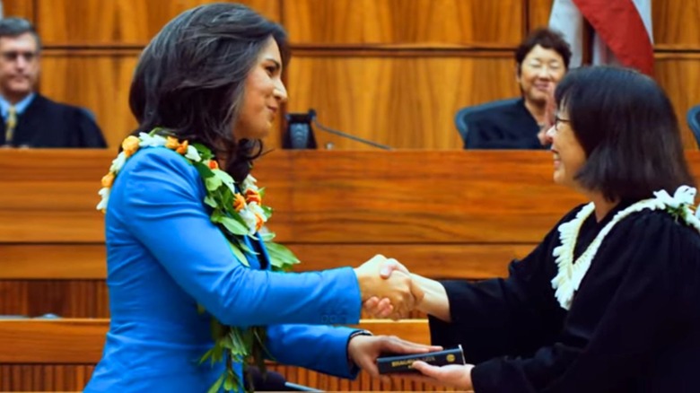 Tulsi Gabbard taking the oath of office on a Bhagavad Gita