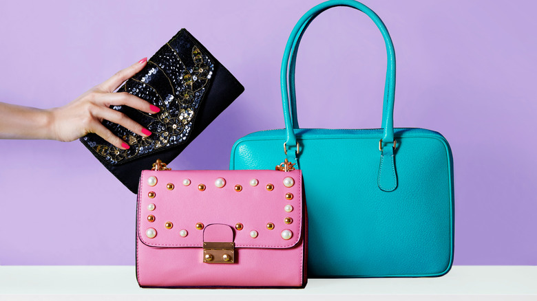 Three colorful handbags