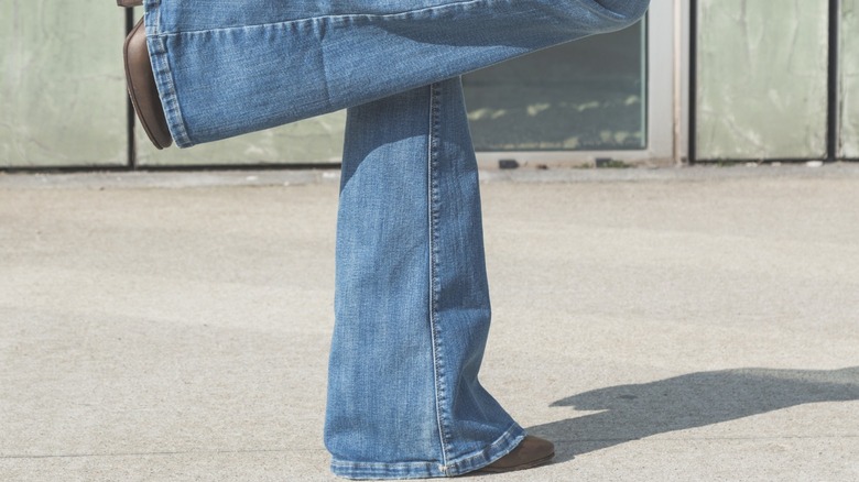 Flared-leg jeans touching ground