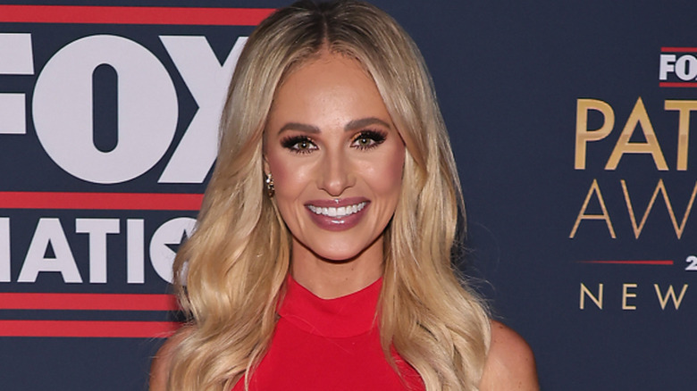 Tomi Lahren smiling on a red carpet