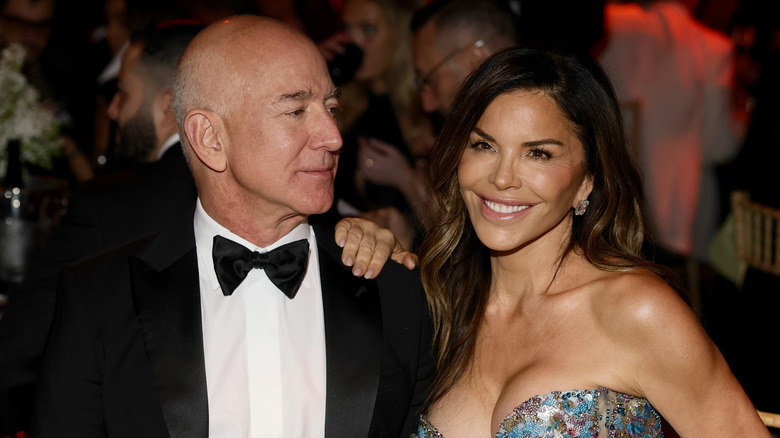 Jeff Bezos looking at Lauren Sanchez smiling
