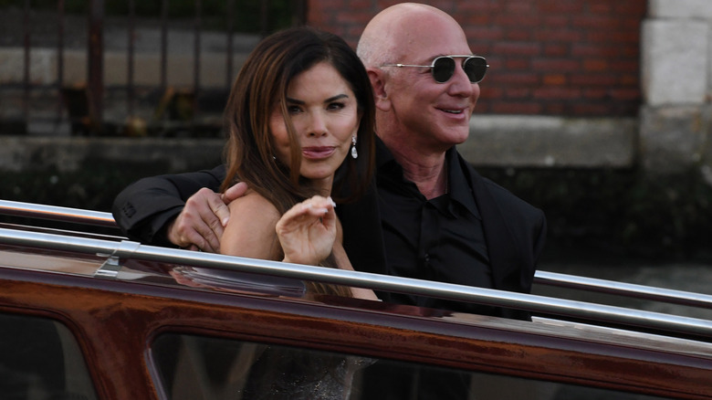 Lauren Sanchez waving with Jeff Bezos