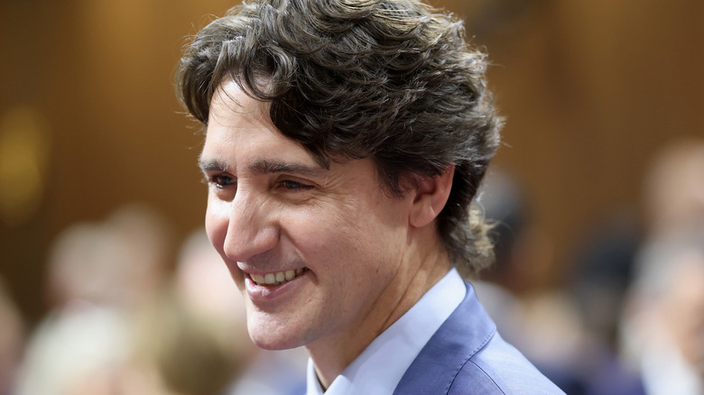 Justin Trudeau smiling in a light blue suit