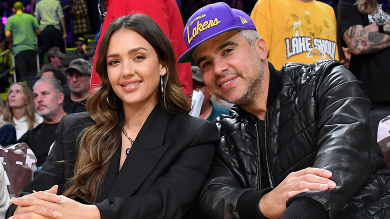 Jessica Alba and Cash Warren sitting in crowd