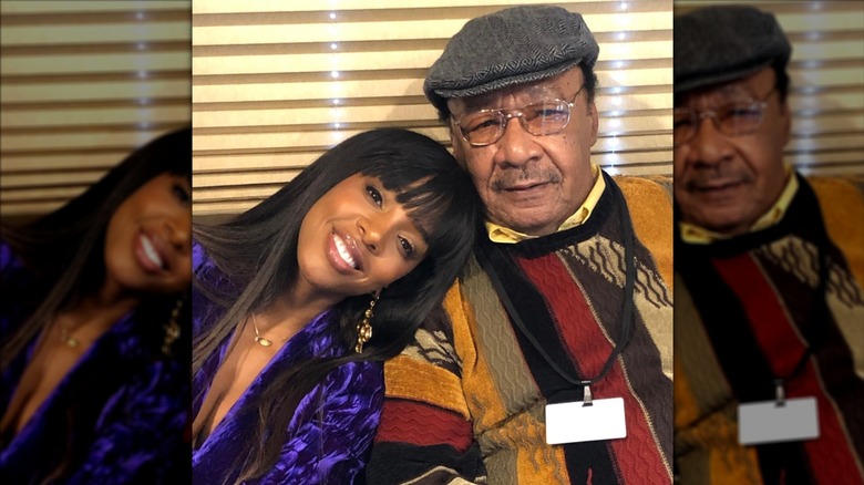 Kelly Rowland smiling in a picture with her father Christopher