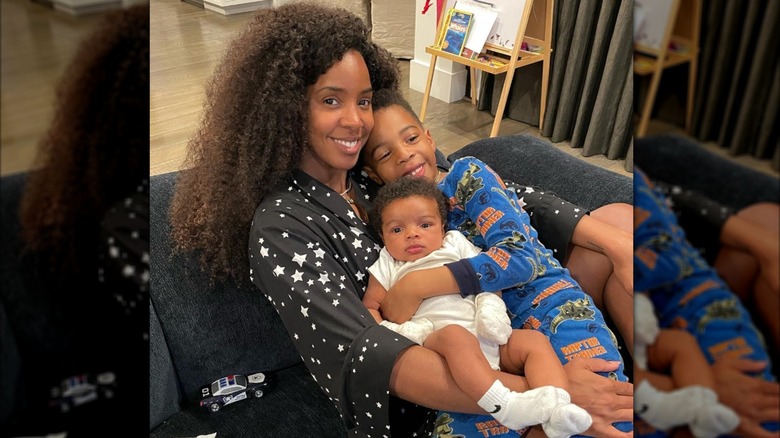 Kelly Rowland smiling for the camera with her two sons