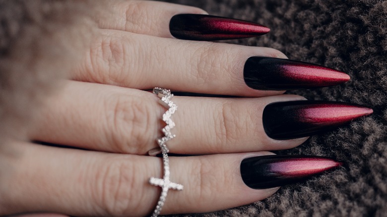 Gothic Black Manicure Style Gel Polish With Black Glossy Finish And Black  Flame Design On Wooden Table Stock Photo - Download Image Now - iStock