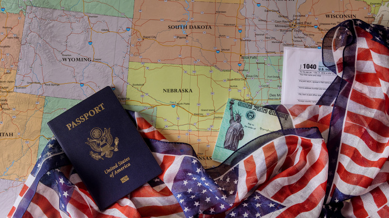 passport and flag on top of map